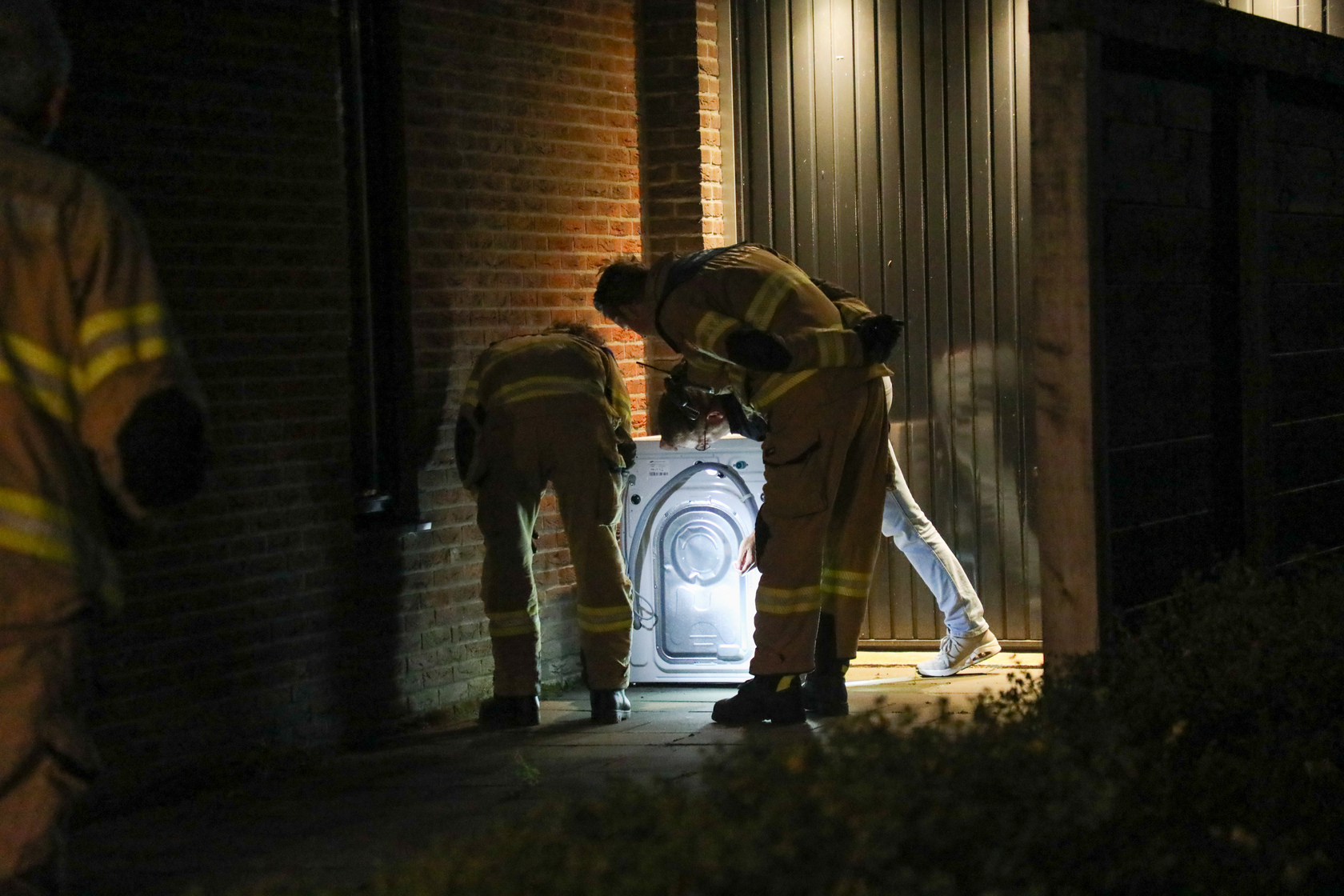 Wasmachine vat vlam in woning, kinderen flink geschrokken